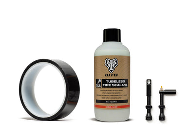 State Bicycle tubeless ready kit contents — tubeless rim tape roll, WTB sealant 8oz bottle, two tubeless valves with valve core tool