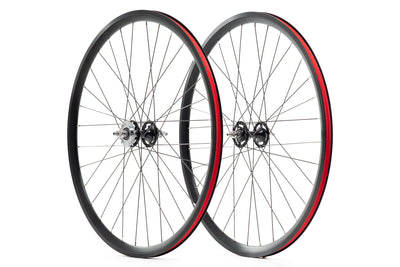State Bicycle Black Label v3 mid-profile wheel set — front and rear pair with black rims, red rim tape, and flip-flop hub