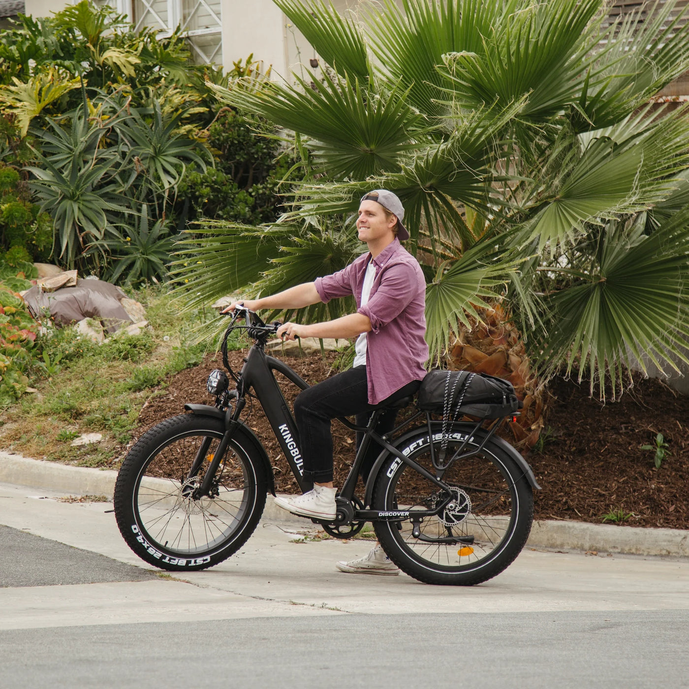 Man sitting on Kingbull Discover electric bike while stationary, showing comfortable seating position