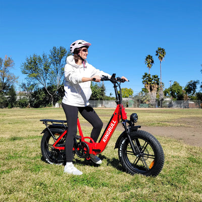 A woman riding a EBike Literider on the grass