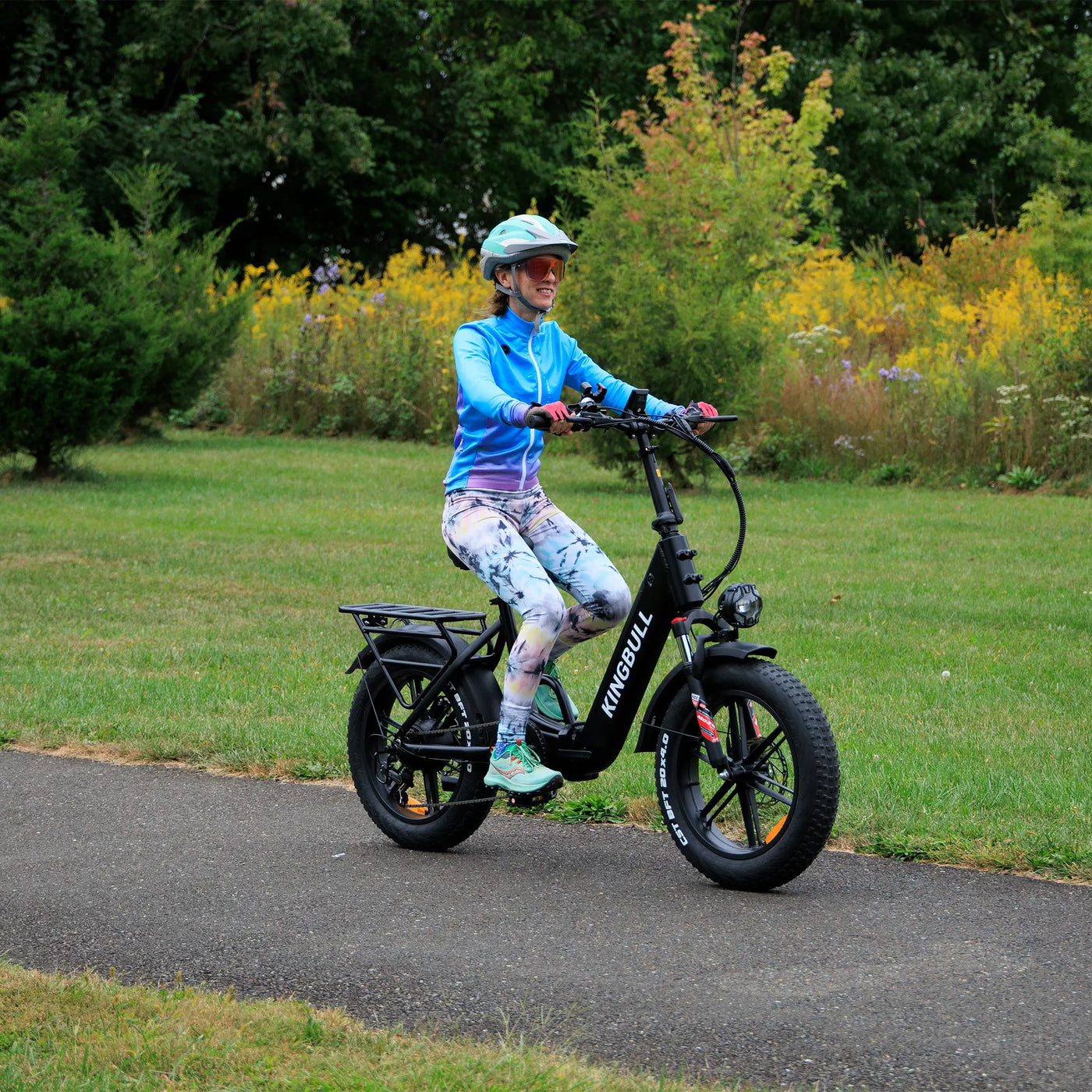 Woman riding Kingbull Literider Folding electric bike showing comfortable handling
