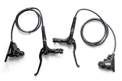 State Bicycle All-Road hydraulic disc brake set for flat bars — flat lay showing front and rear levers, calipers, and hydraulic lines