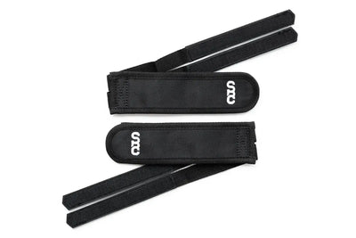 Pair of black State Bicycle Co. foot retention pedal straps with SBC logo, flat-lay on white background
