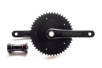 Essor USA Aerodash track crankset — top-down view of matte black aero disc chainring with AERODASH branding and crank arms